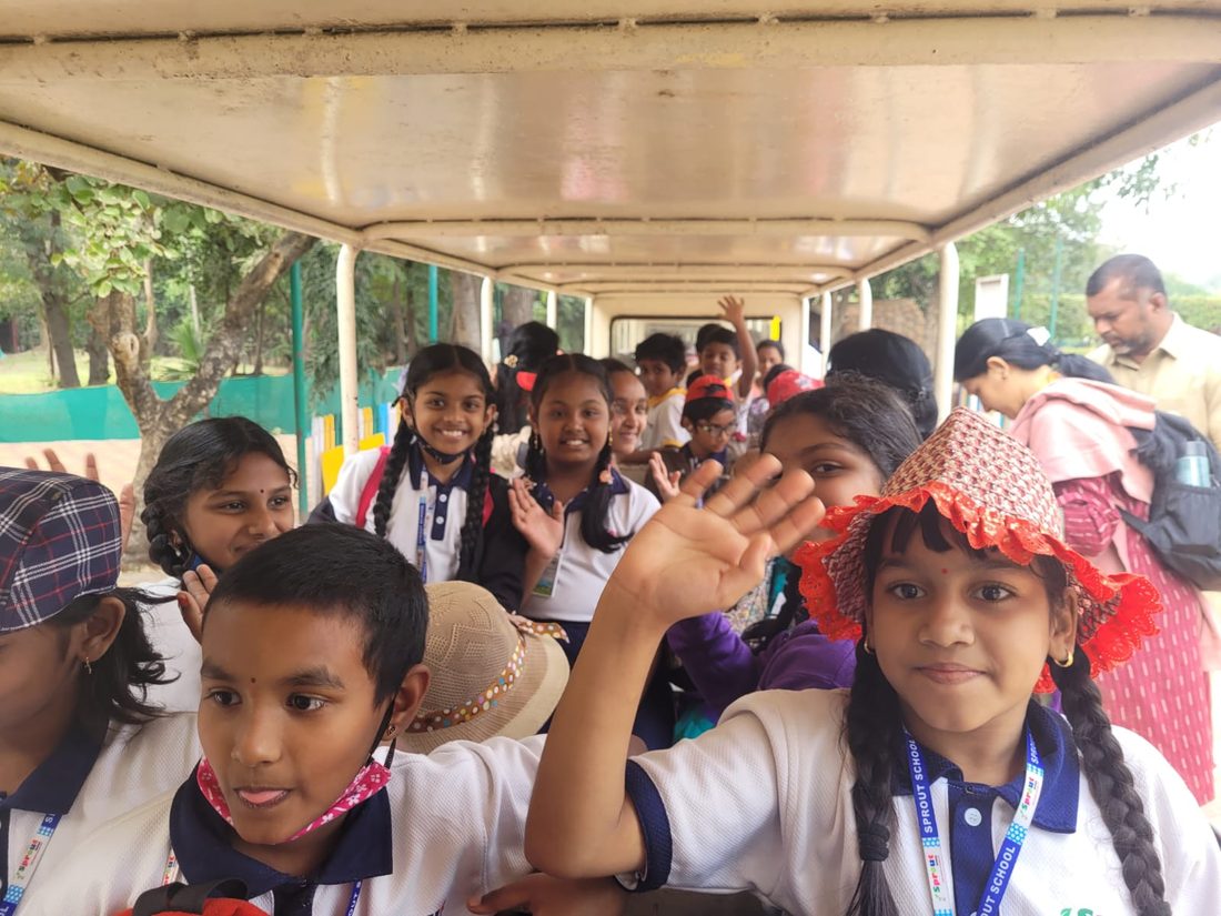 Happy Sprout students smiling and waving