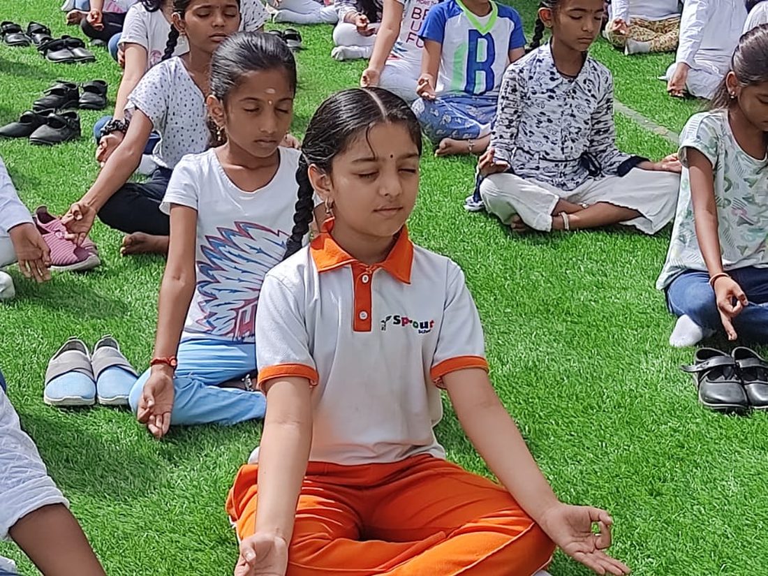 Sprout children in an outdoor class on the lawn